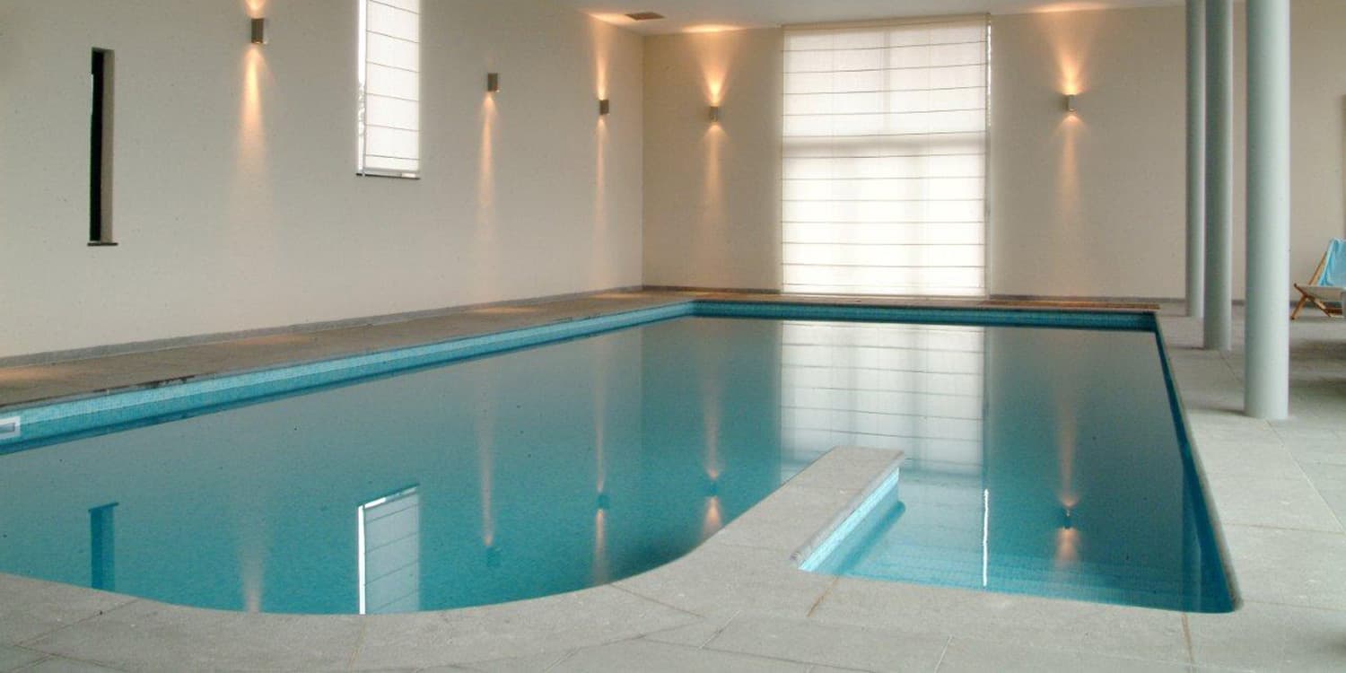 Swimming pool surround in Belgian Blue with a Pocco Veccio finish