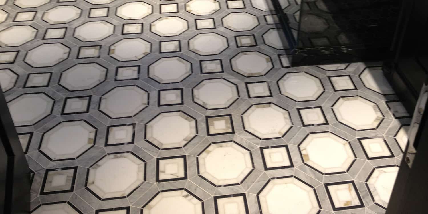 Bespoke floor made from Calacatta, Bardiglio, Thassos and Negro Marquina marble