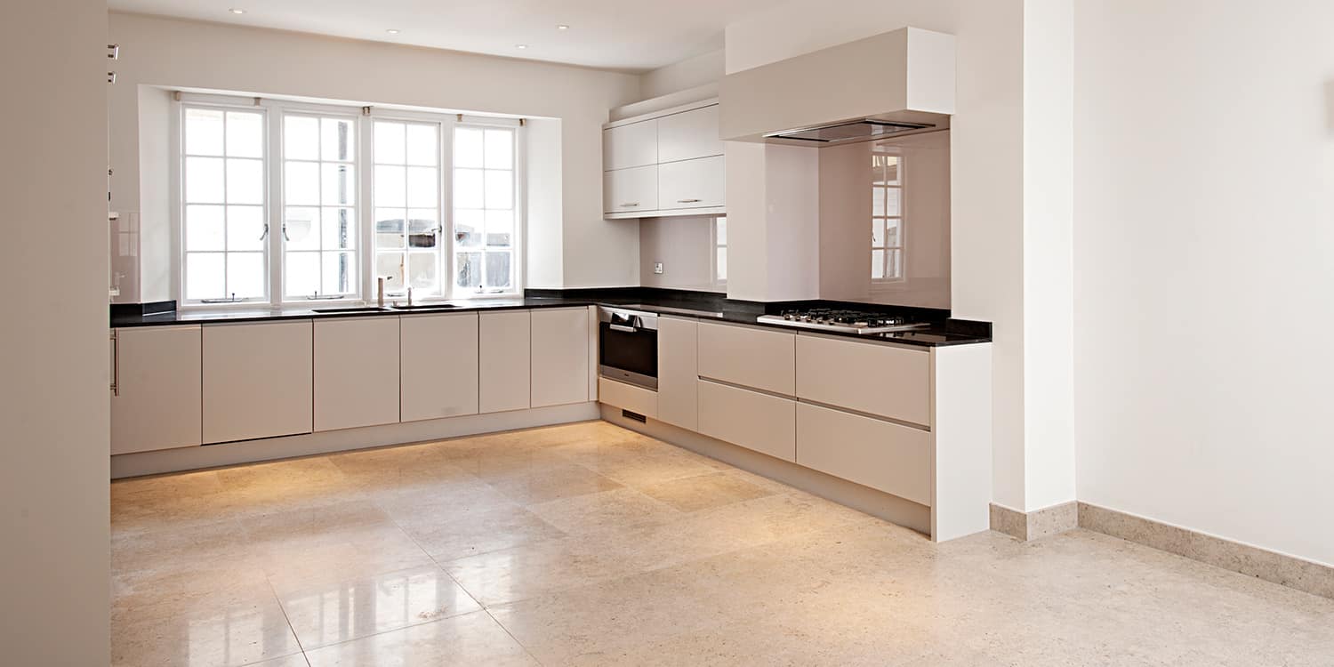 Nero Absoluto granite worktop and Molianos Beige limestone floor